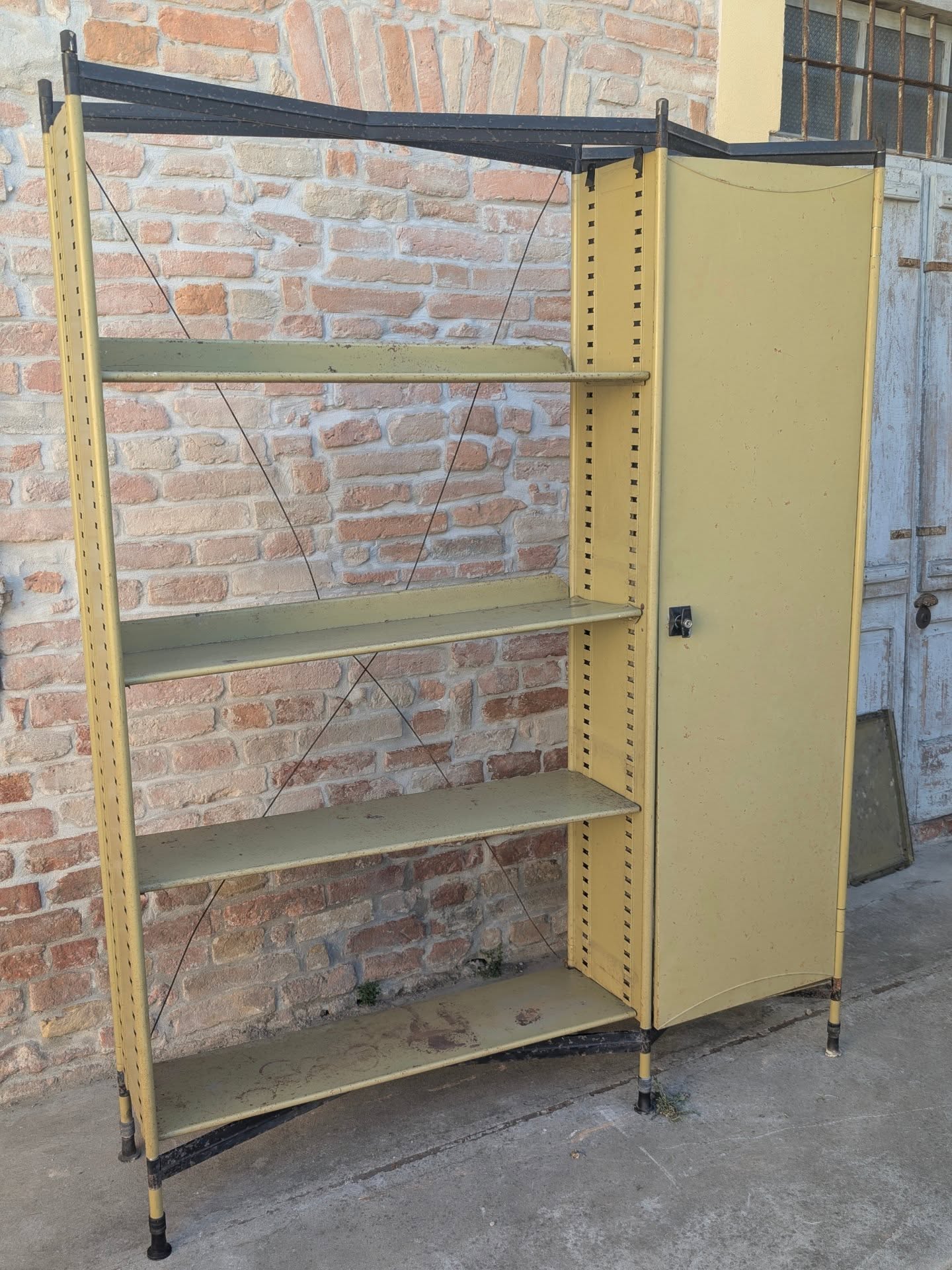 BBPR for Olivetti – “Spazio” Modular Bookcase, Italy, 1950s An exceptionally refined example from the iconic Spazio series designed by BBPR for Olivetti, embodying the intellectual elegance and architectural rigour that defined post-war Italian design at its finest. Constructed in lacquered steel, the composition combines adjustable shelving with an integrated storage cabinet, creating a harmonious balance between utility and visual lightness. The slender uprights, delicate cross-bracing and sculptural metal panels reveal the unmistakable influence of architectural thinking, transforming a functional storage system into a sophisticated interior statement. Conceived for executive offices and cultured private residences, the Spazio programme represented Olivetti's visionary commitment to modern living, where technological progress, craftsmanship and aesthetic excellence coexisted seamlessly. Today, surviving examples are increasingly sought after by discerning collectors, architects and connoisseurs of twentieth-century design, celebrated for their timeless proportions, historical significance and enduring versatility. #BBPR #OlivettiSpazio #ItalianDesignMasterpiece #MidCenturyModern #CollectorsFurniture