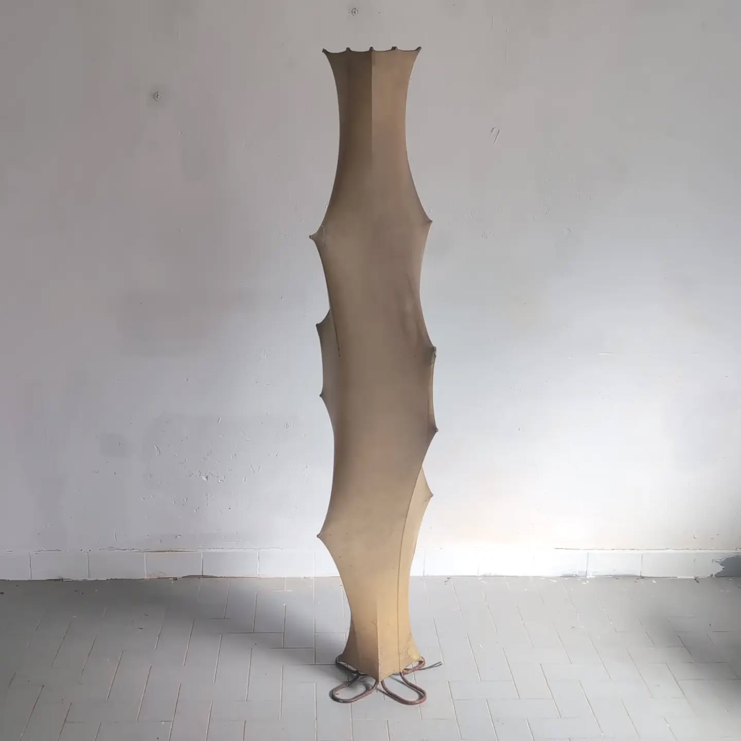 Tobia Scarpa — “Fantasma” Floor Lamp for Flos, 1961 An exceptional example of Tobia Scarpa’s celebrated Fantasma floor lamp, designed in 1961 for Flos and among the most sculptural expressions of post-war Italian lighting. Its extraordinary vertical silhouette is formed by a slender internal steel structure enveloped in the revolutionary Cocoon sprayed resin, creating an almost architectural presence — somewhere between sculpture, light and organic form. What makes this particular example especially compelling is its superb original patina. The Cocoon surface has matured naturally over the decades into a beautifully warm, parchment-like tone, displaying the subtle variations and translucency that only genuine age can produce. Rather than diminishing the piece, this remarkable patination gives it exceptional depth and character, and bears witness to more than sixty years of history. Tobia Scarpa (Venice, 1935), son of the great Venetian architect Carlo Scarpa, is one of the defining figures of twentieth-century Italian design. Working both independently and alongside his wife Afra Scarpa, he created furniture, interiors and lighting for many of Italy’s most distinguished manufacturers, including Flos, B&B Italia, Cassina and Molteni. His work is characterised by an extraordinary understanding of materials, construction and proportion, combining the rigour of architecture with an unmistakably Italian sensuality. Fantasma remains one of his most radical and recognisable designs: an illuminated sculpture rather than simply a lamp, and an enduring icon of the golden age of Italian design. #TobiaScarpa #Flos #ItalianDesign #MidCenturyDesign #VintageLighting